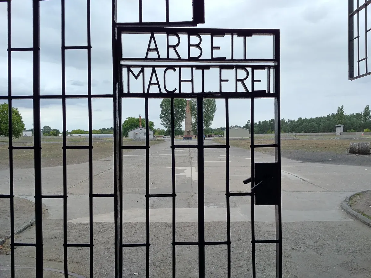 Gate inscription at Sachsenhausen concentration camp on a small-group tour from Berlin